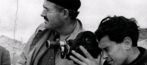 Ernest Hemingway with film cameraman, Joris Ivens, and two soldiers during the Spanish Civil War. 1937-1938